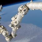 Professor Steve Robinson on one of the International Space Station's robotic arms. Robinson, Schofield and Joiner are studying ways to make these robotic arms easier to control.